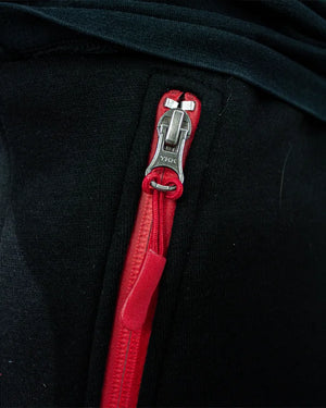 Enfoque detallado bosillos rojos con cremallera pantalón Bruiser Legend negro.