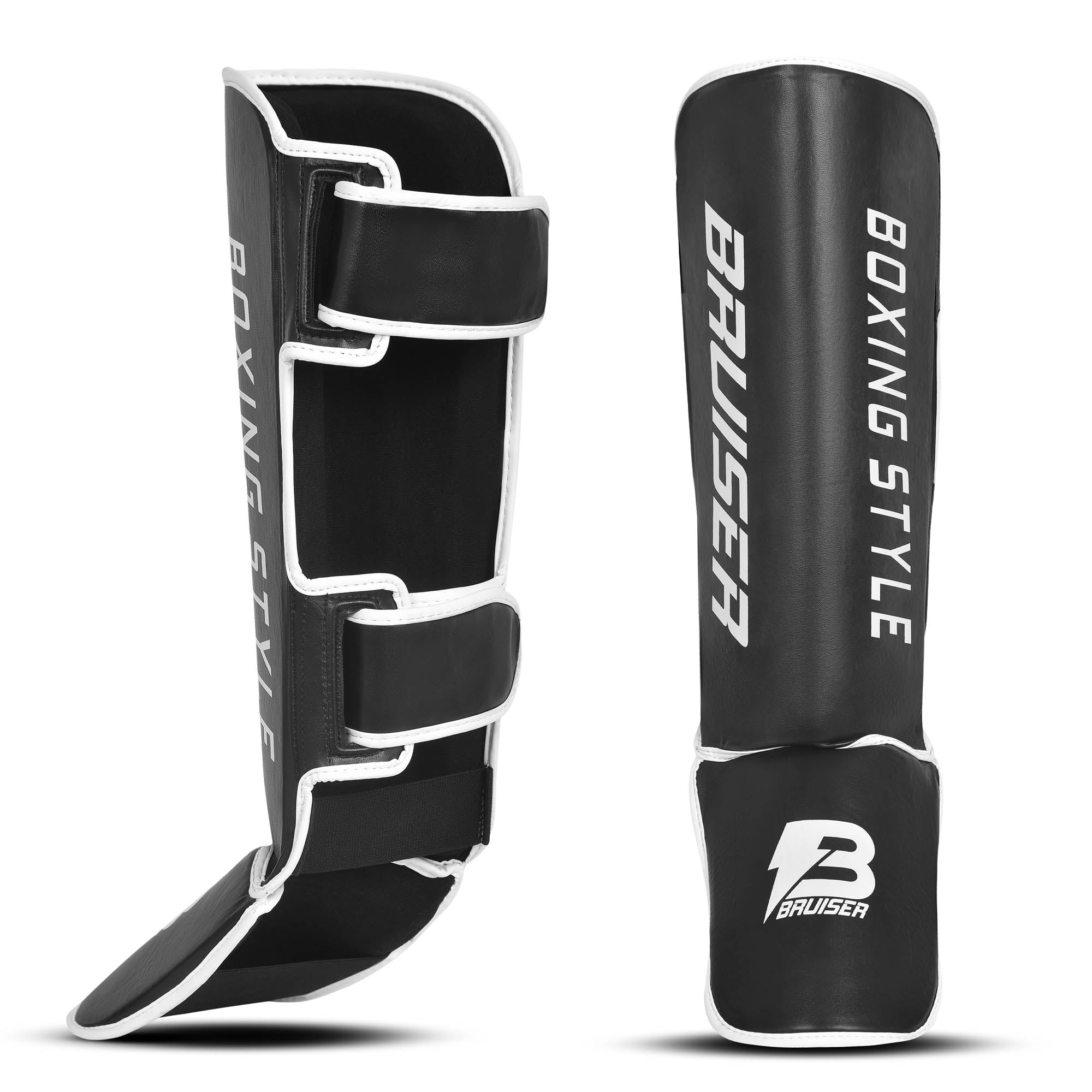 Espinilleras de boxeo y muay thai  negras con detalles blancos y logo Bruiser en la parte frontal lateral, hechas de polipiel con relleno de alta densidad que absorbe golpes y protege espinillas. Sistema de velcro reforzado para entrenamiento de contacto. Imagen frontal.