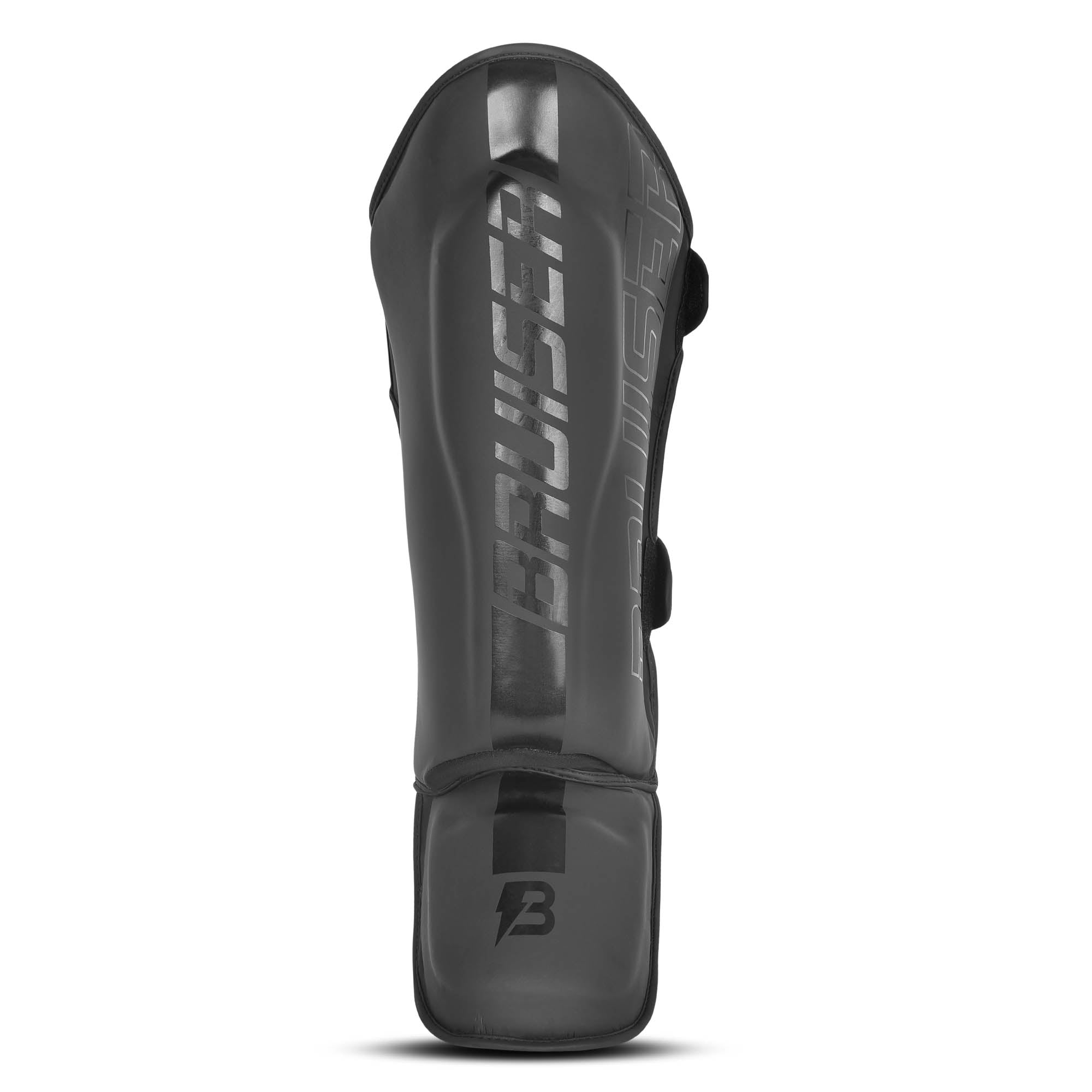 Espinillera marca Bruiser color negro. Logo en el centro. Hechas de piel sintética y rellena de espuma y látex. Doble cierre de velcro. 