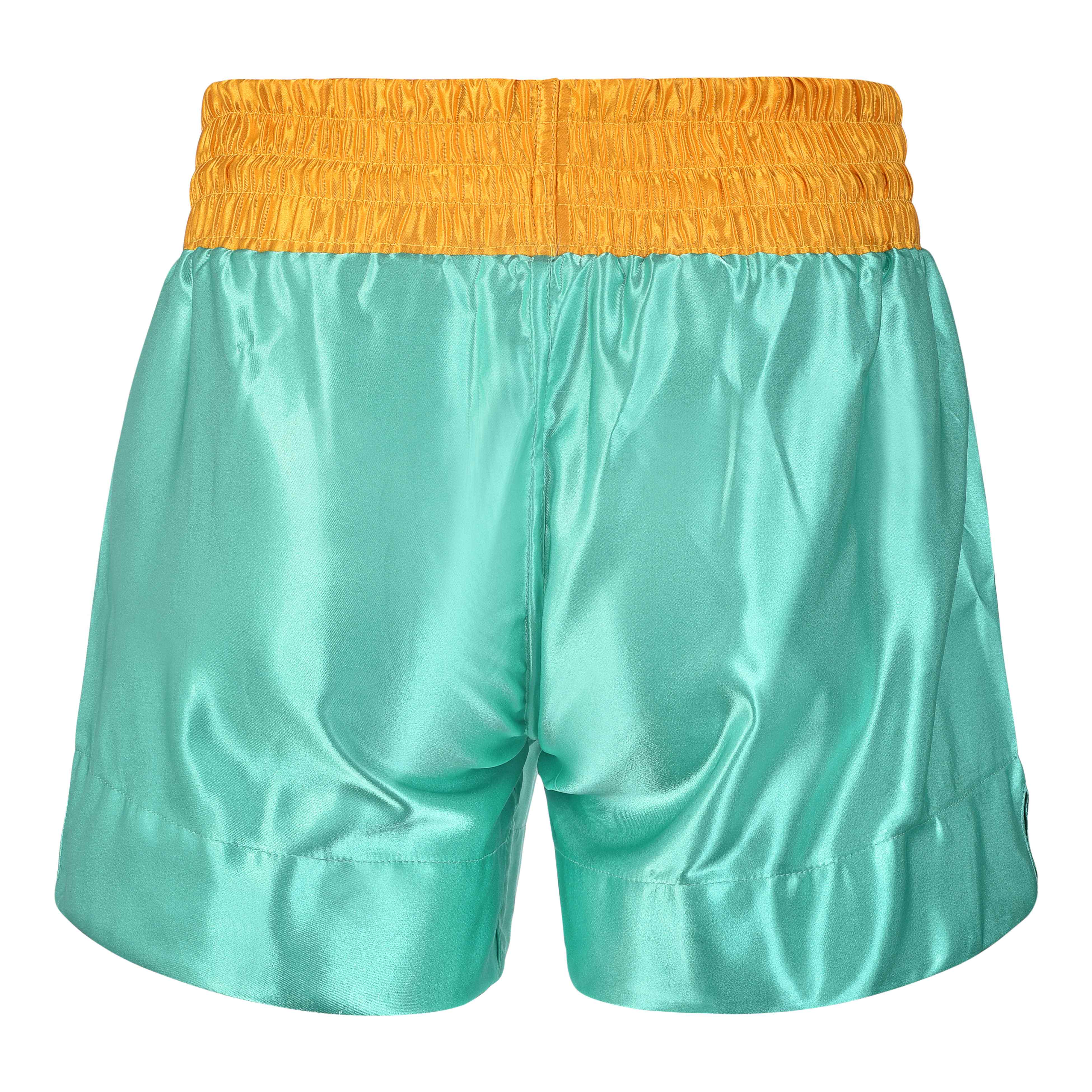 Short de Muay Thai satén color turquesa y dorado. Material cómodo y transpirable con ajuste firme. 